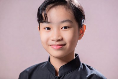 Asian girl in black qipao smiling