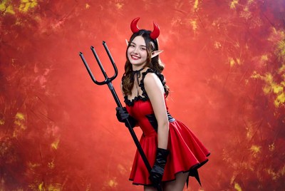 Asian woman in sexy devil costume