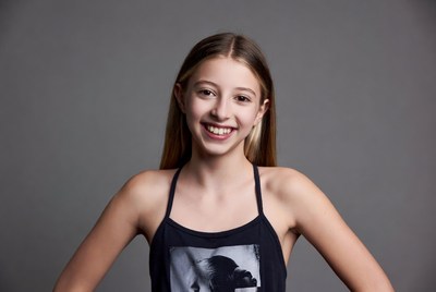 Smiling teenage girl in black tank top