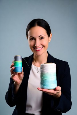 Woman holding colorful thread spools