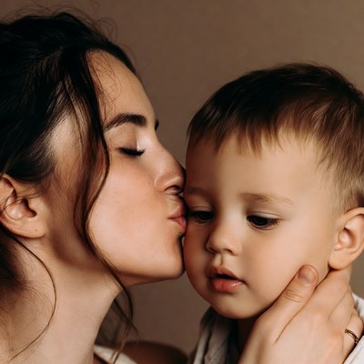 Mother kissing her baby boy