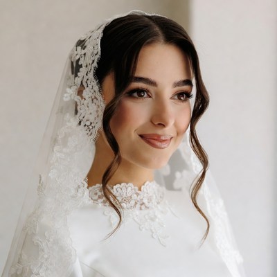 Bride with lace veil smiling