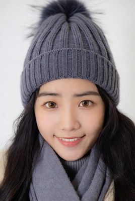 Asian woman in gray knit beanie