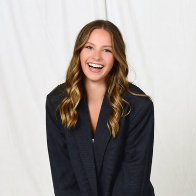 Smiling woman in pinstripe blazer