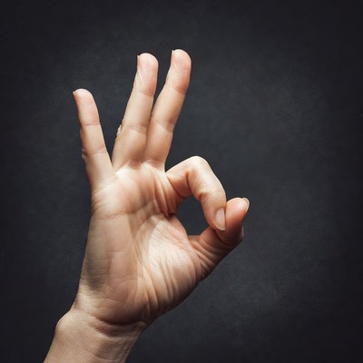 Hand making OK sign