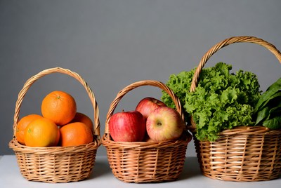 Oranges Apples Lettuce in Wicker Baskets