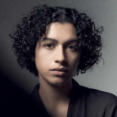 Young person with curly hair