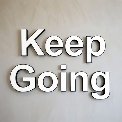 Keep Going sign on wall