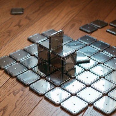 Silver magnetic tiles on wooden floor