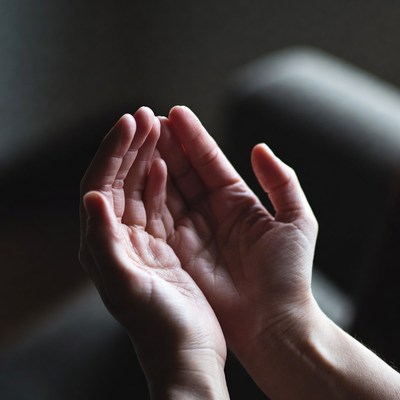 Hands raised in prayer