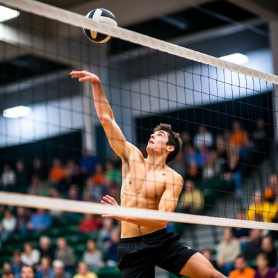 Man spiking volleyball over net
