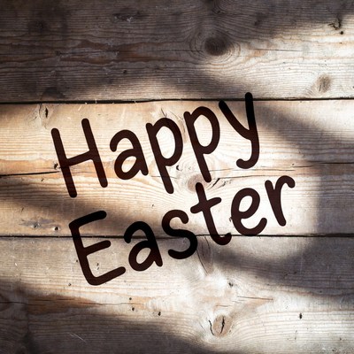 Happy Easter on wooden background