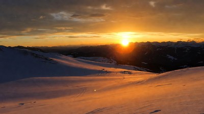 Sunset over snowy mountains