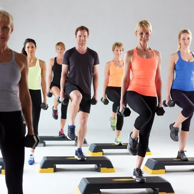 Group doing dumbbell step-ups