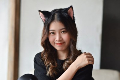Asian woman wearing cat ears