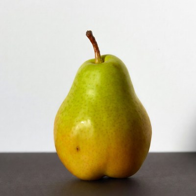 Green pear on black background