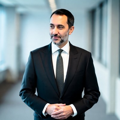 Man in suit standing in hallway