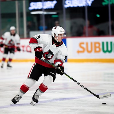 Hockey player skating with puck