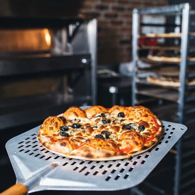 Pizza on Paddle in Pizzeria