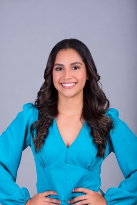 Smiling Latina woman in blue dress