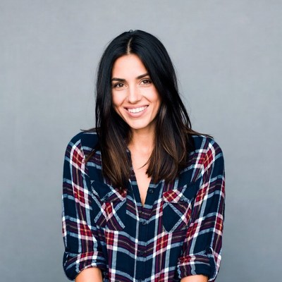Smiling woman in plaid shirt