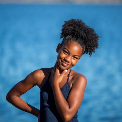 African-American girl smiling by lake