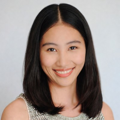 Asian woman smiling in beaded dress