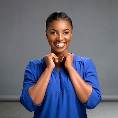 African-American woman smiling hands at neck