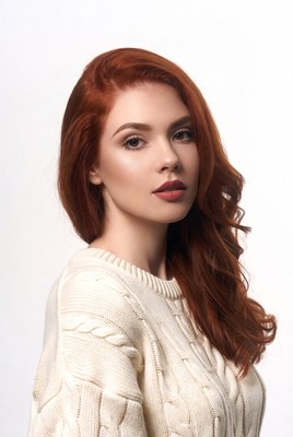 Redhead woman in white sweater
