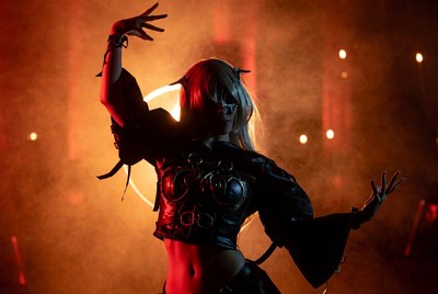 Cosplay woman posing dramatically in red light