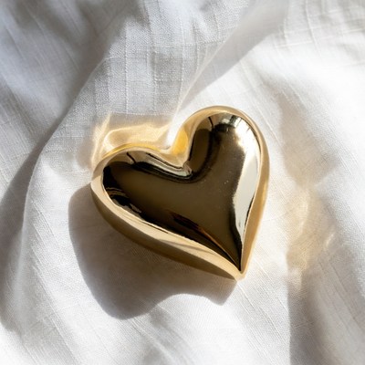 Shiny Gold Heart on White Fabric