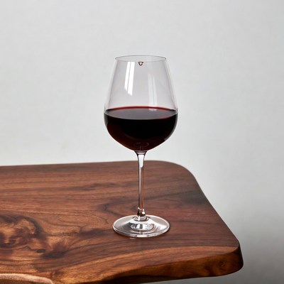 Red Wine Glass on Wooden Table