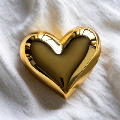 Shiny Gold Heart on White Fabric