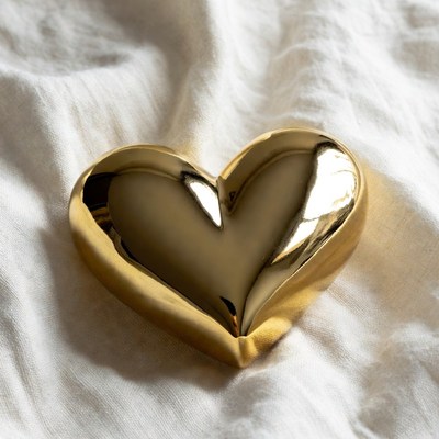 Shiny Gold Heart on White Fabric