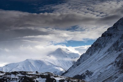 Snowy Mountain Peak with Clouds