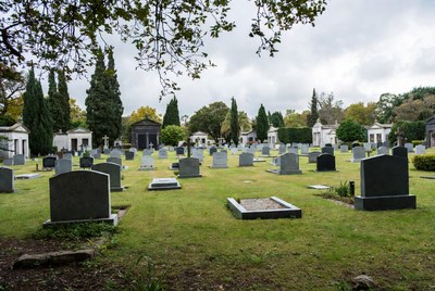 Cemetery with gravestones and trees