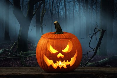 Jack-o'-lantern in foggy forest