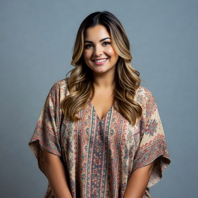 Smiling woman in patterned blouse