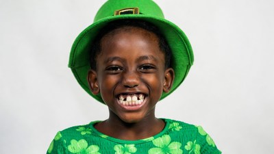 African-American boy in leprechaun costume