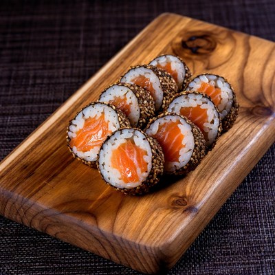 Salmon Sushi Rolls on Wooden Board