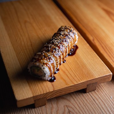 Sushi roll with sesame and sauce
