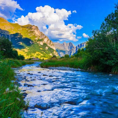 Mountain River Flowing Through Valley