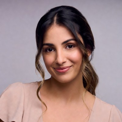 Smiling woman with dark wavy hair