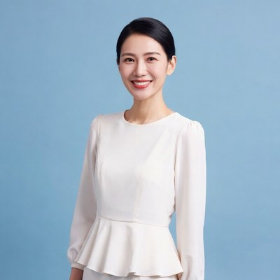Asian woman smiling in white blouse