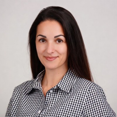 Woman in checkered blouse smiling