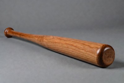 Wooden Baseball Bat on Gray Background