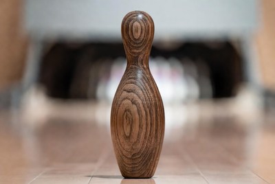 Wooden bowling pin on lane