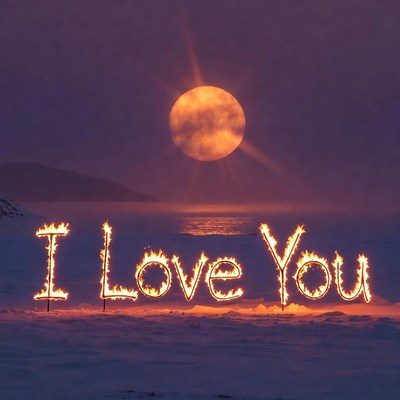 Fiery 'I Love You' on Snowy Beach