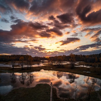 Autumn Sunset Over Marshland with Boardwalk