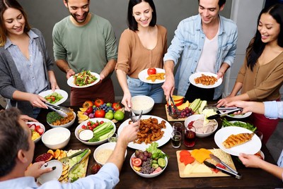 Diverse group serving buffet food